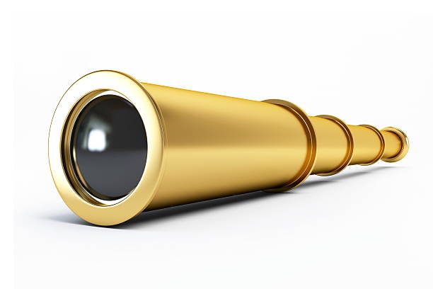 Gold spyglass fully extended on white background stock photo