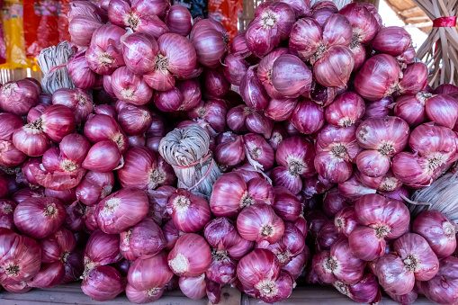 Shallots are small round Vegetable that are roots of crop and are similar to onion.they have a strong taste are used for flavoring other food.