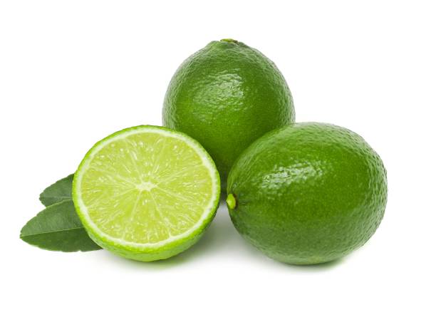 istock Fresh green lemons and lime leaves  placed on a white background. 1767904766