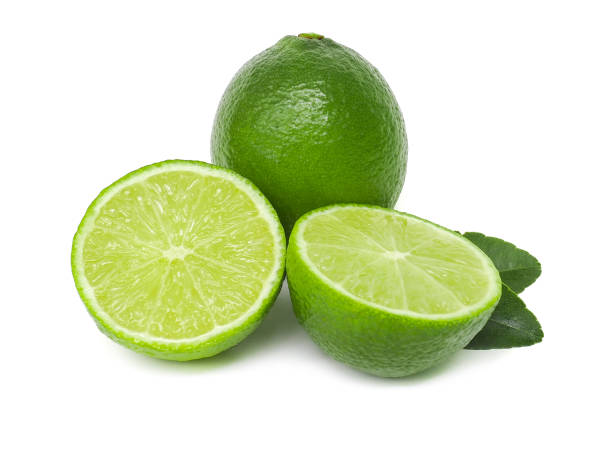 istock Fresh green lemons and lime leaves  placed on a white background. 1767905809