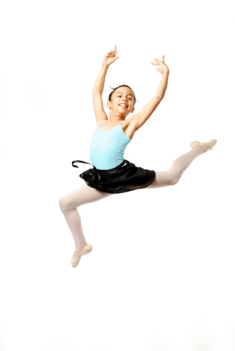 Young Ballerina Leaping on White Background
