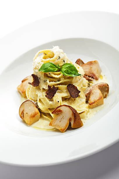 Noodles "Tagliatelle with Mushroom, Cream Sauce, Truffle and Basil Leaf" Cepe stock pictures, royalty-free photos & images