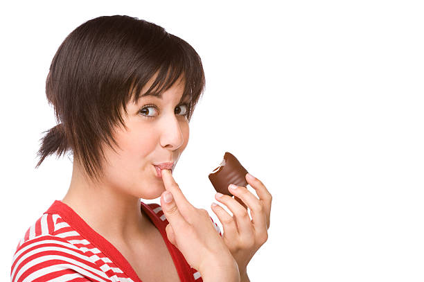 istock White female with short hair enjoying chocolate 176792863
