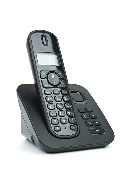 Modern black digital cordless phone with answering machine isolated on the white background