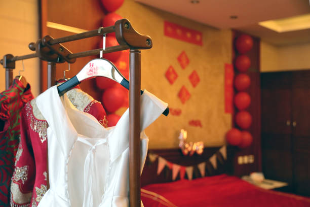 Hangers and dresses in Chinese wedding room