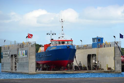 Pointe-à-Pitre, Grande-Terre, Guadeloupe: floating dry dock, dry cargo vessel La Saintoise receiving maintenance - Port of Guadeloupe - ('grand port maritime de la Guadeloupe', aka 'Guadeloupe Port Caraïbes').