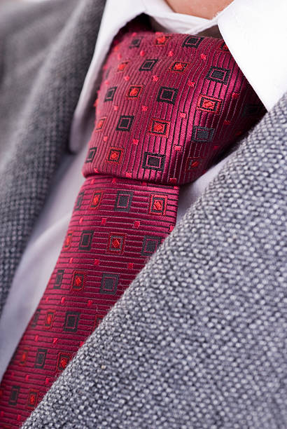istock red necktie and grey suit detail 176793520