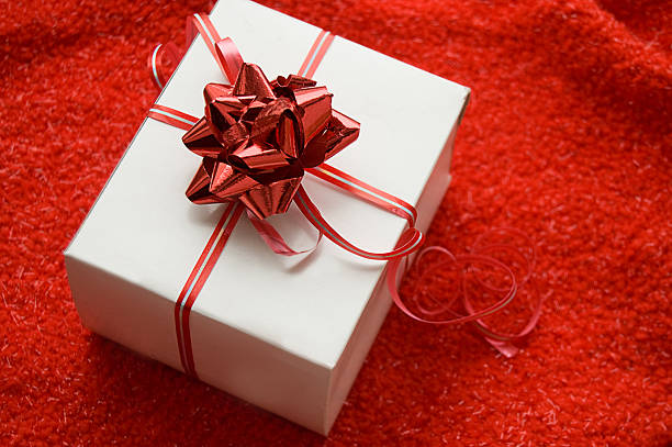 istock White gift box with red satin ribbon 176793656