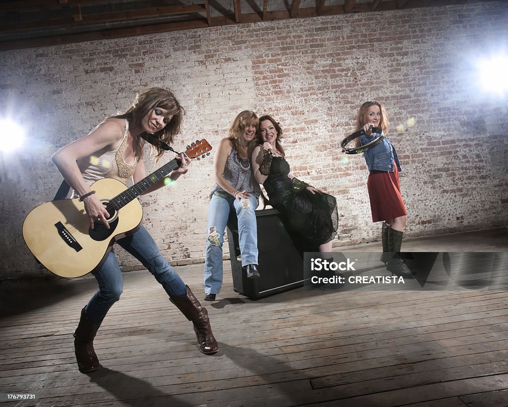 Female musicians All girl band practicing before a big performance Country and Western Music Stock Photo