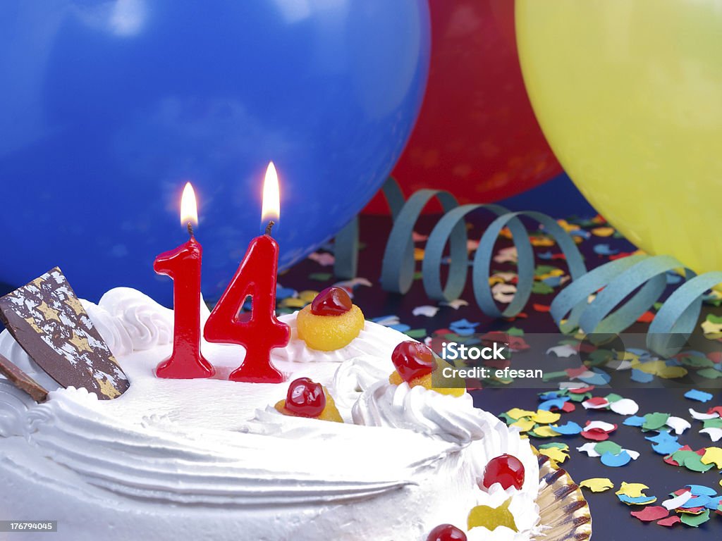 14th. Anniversary 14th. Anniversary / Birthday cake in a Party background with balloons and party strings. 14-15 Years Stock Photo
