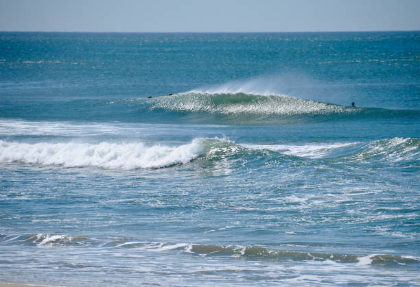 istock Sunlit Wave Breaking with Spray Off the Top 1767943084