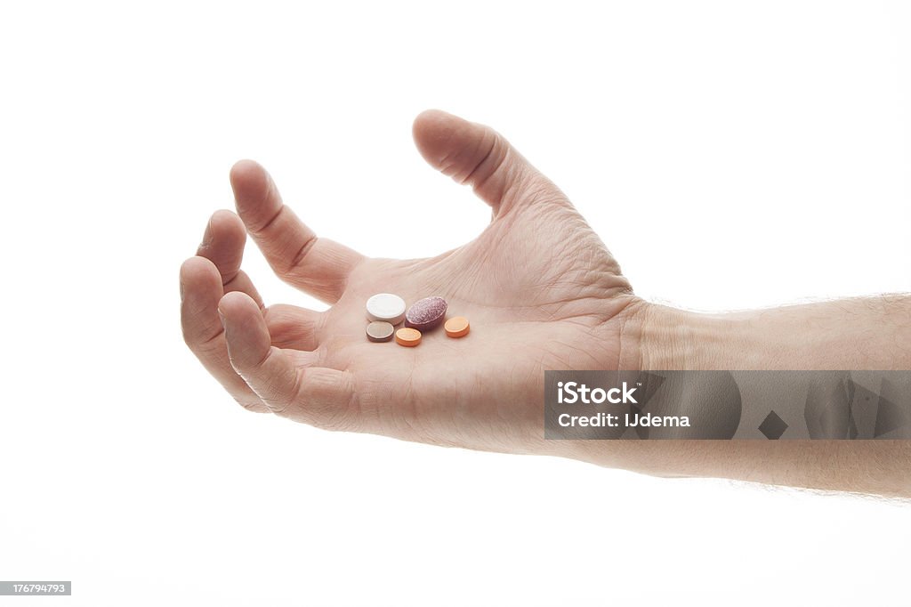 Hand holding Pillen in einer wütend oder verärgert Weise - Lizenzfrei Arzt Stock-Foto