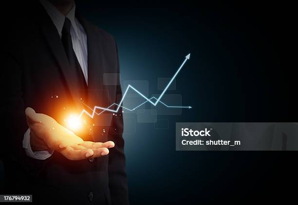 Hand Holding A Rising Arrow Stock Photo - Download Image Now - Making Money, Moving Up, Business