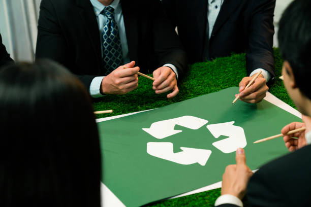 istock Recycle icon on meeting table with business people. Quaint 1767954370