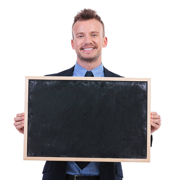 istock business man holds a blackboard 176795754