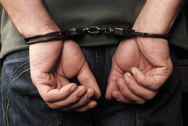 Handcuffs Handcuffs deportation stock pictures, royalty-free photos & images