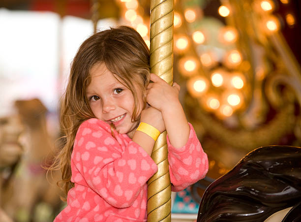istock Adorable Pre-K Girl on Carousel 176797199
