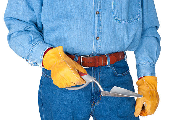 istock Workman Holding Garden Trowel with Leather Gloves,  Isolated on White, 176797276