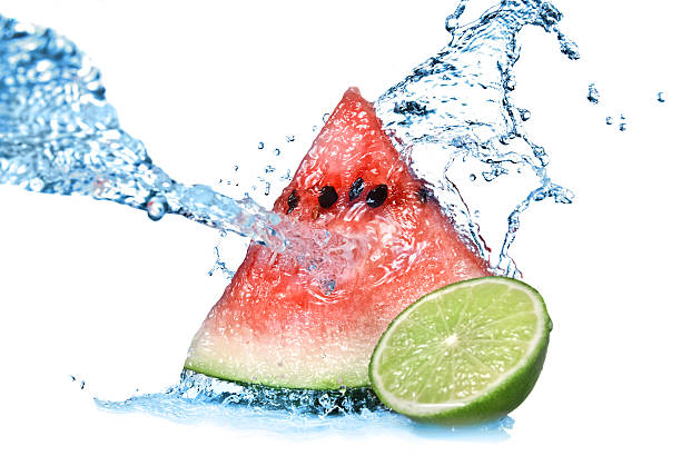 istock watermelon with lime and water splash isolated on white 176797525