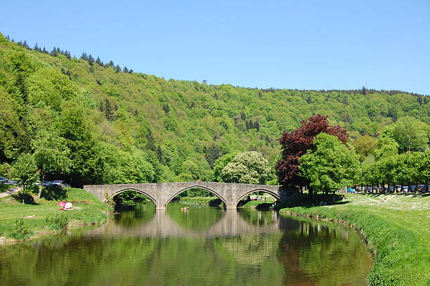 Old architecture bridge on a river stock photo