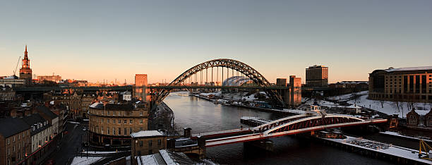 Newcastle Gateshead Winter Panorama "Newcastle upon Tyne and Gateshead, England. A winter stitched panorama of the Tyne and swing bridges as they cross the river." tyne bridge stock pictures, royalty-free photos & images