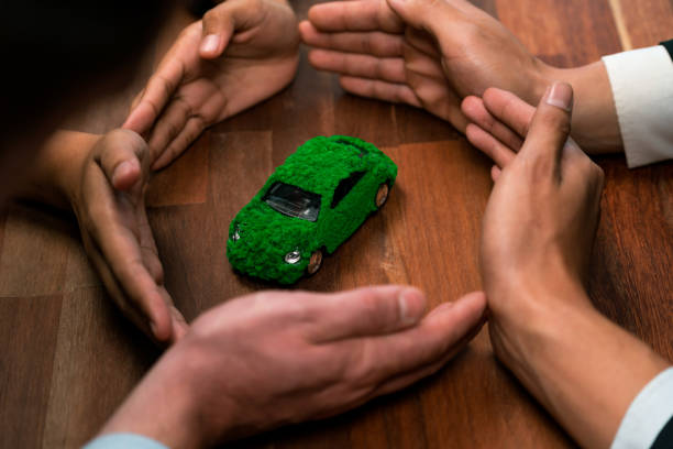istock Business people synergy holding EV car model. Quaint 1767975497