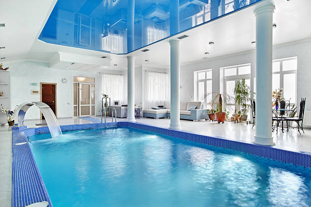Indoor big blue swimming pool interior in modern minimalism styl stock photo
