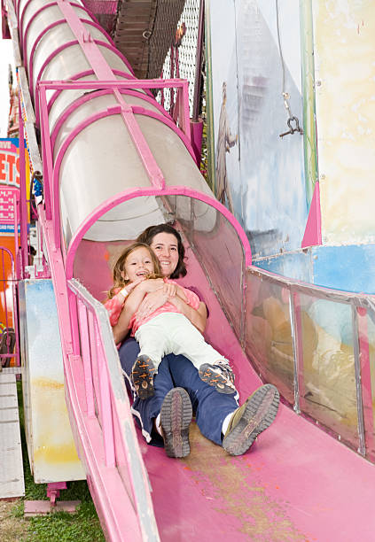 istock Mother and Daughter on Carnival Slide 176798209