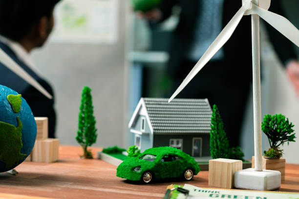 istock EV car model with mockup wind turbine on blurred background meeting. Quaint 1767983558