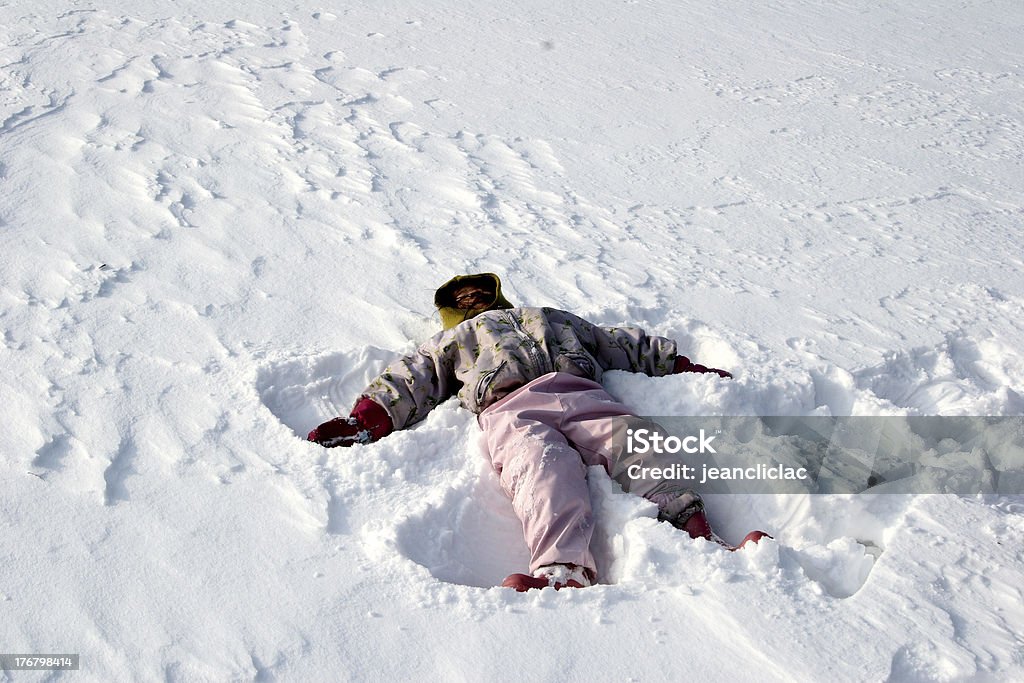 children playing child playing and jumpingin the snow a sunny winter day Boys Stock Photo