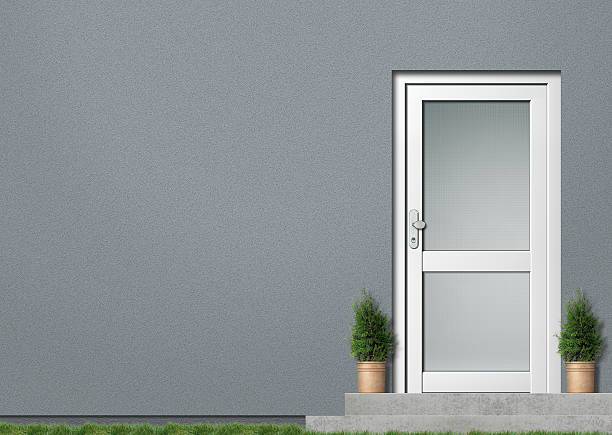 istock Grey house wall and white door 176798540
