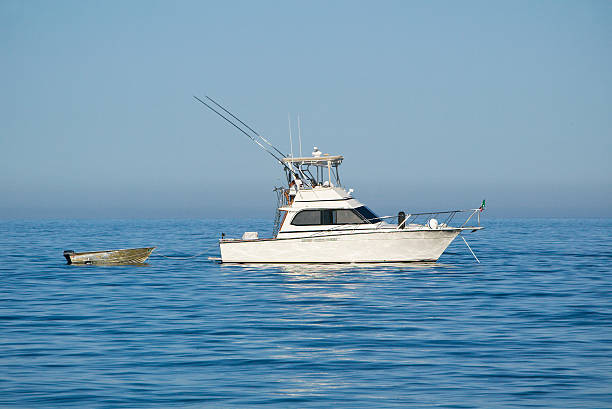 istock Fishing Boat with Dinghy Tied to the Back 176798603