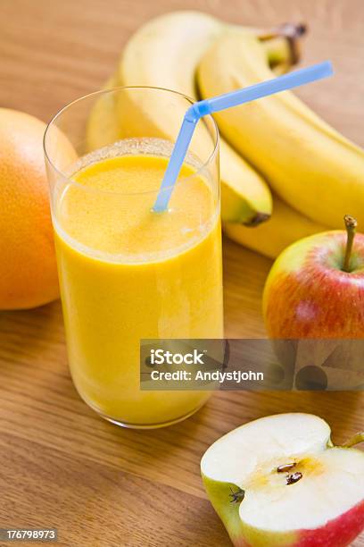 Glass Of Fruit Smoothie On Kitchen Table Stock Photo - Download Image Now - Apple - Fruit, Banana, Breakfast