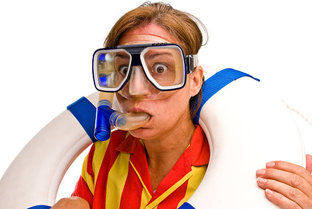 Female diver looking at something with shocked expression stock photo