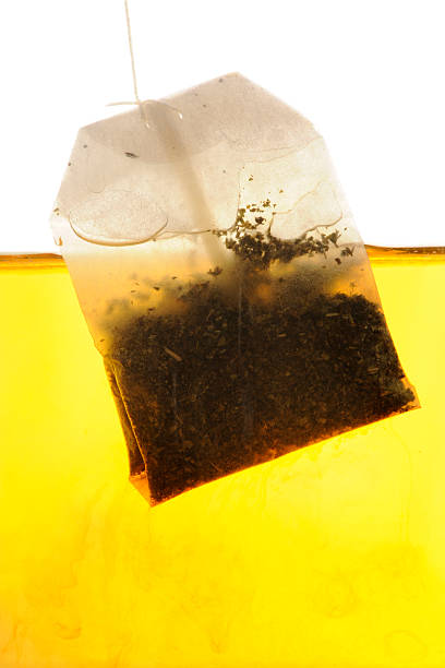 istock Peppermint Tea bag hanging into hot water 176799450