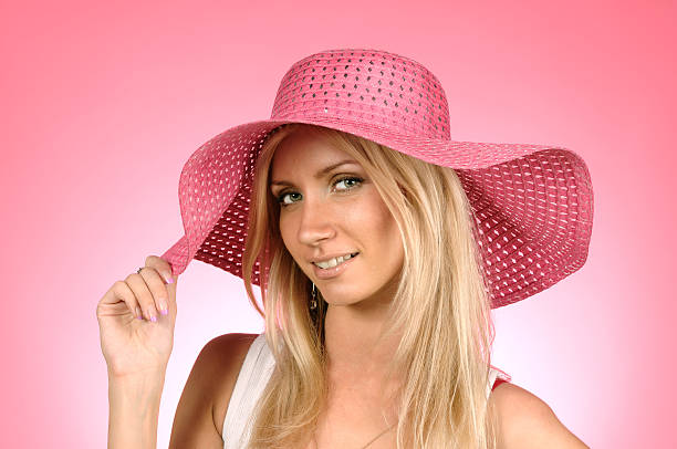 istock woman in a pink hat 176800413