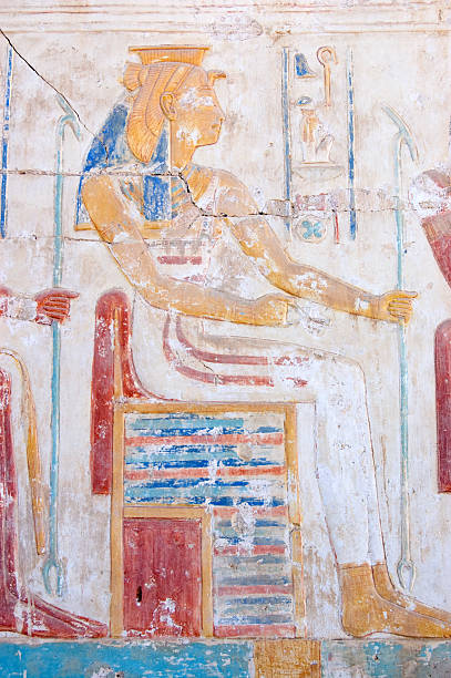 Ancient Egyptian Goddess Mut "An Ancient Egyptian carved hieroglyphic painting of the goddess Mut.  One of the symbolic mothers of the king, she is shown with a vulture headdress.  Wall of the Temple of Ramses II, Abydos, Egypt." abydos stock pictures, royalty-free photos & images