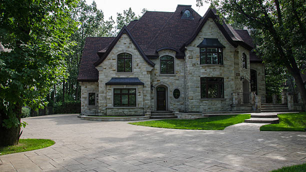 istock Exterior of a large, luxury brick mansion with wide grounds 176800652