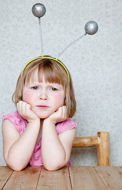 Little Alien - Girl wearing Antennas Stock photo portrait of a girl wearing antennas animal antenna stock pictures, royalty-free photos & images