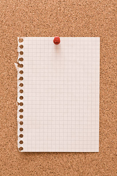 Notebook page pinned to corkboard stock photo