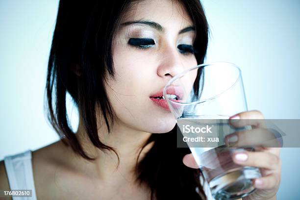 Closeup Of Womans Face About To Drink Glass Of Water Stock Photo - Download Image Now