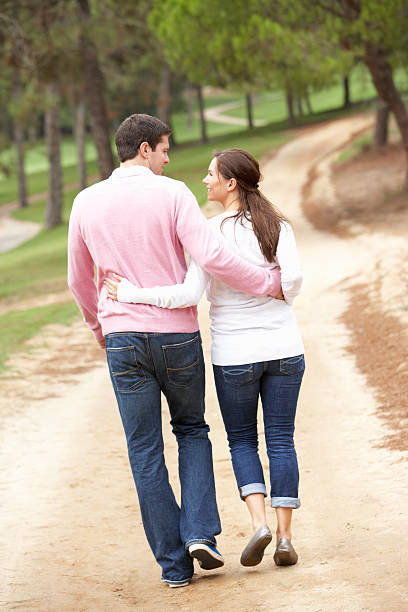 istock Romantic couple enjoying walk in park 176802770