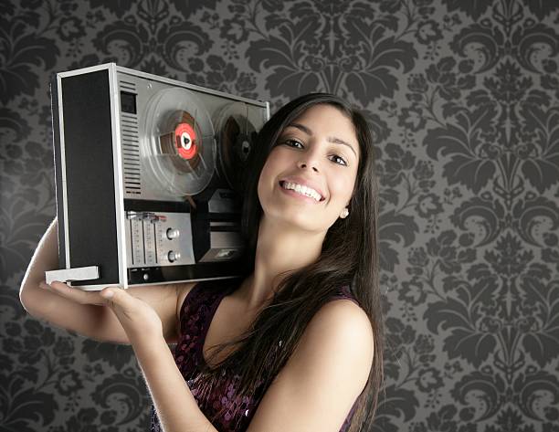 istock Retro open reel tape recorder beautiful brunette Dj 176803457