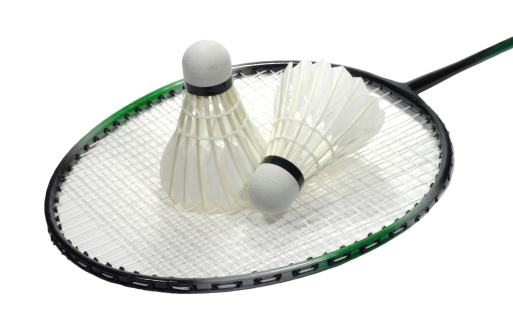 Badminton sport racquet with two feather shuttlecocks isolated on white