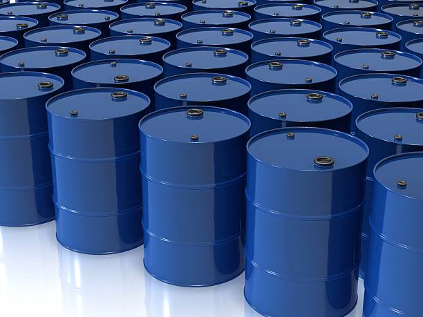 istock Many blue oil drums on a white surface 176804293