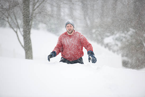 istock Snow covered man in middle of blizzard 176804671