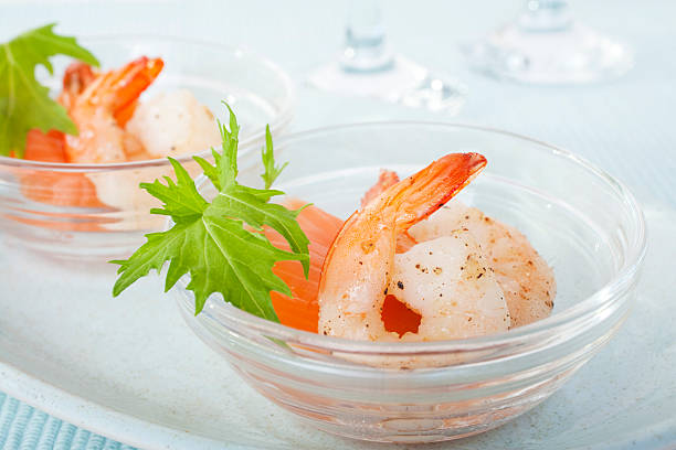 Prawns Shrimp Smoked Salmon Mizuna Appetiser "Dainty appetiser of smoked salmon, prawns and mizuna leaf. Luscious light first course for a special meal." appetiser stock pictures, royalty-free photos & images