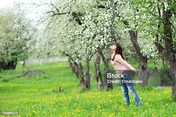 Woman Smelling Flowers Stock Photo - Download Image Now - Adult, Adults Only, Agricultural Field