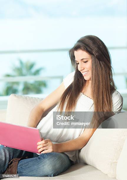 Happy Young Woman With Pink Netbook Stock Photo - Download Image Now - Adult, Adults Only, Antalya Province