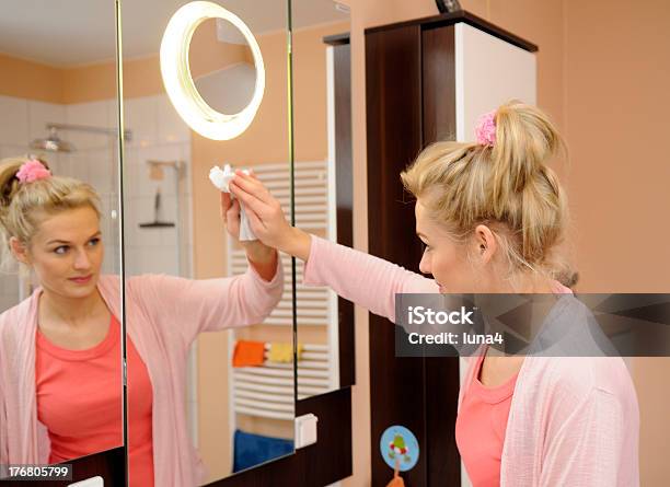 Housewife Cleans A Mirror Stock Photo - Download Image Now - Adult, Adults Only, Bathroom